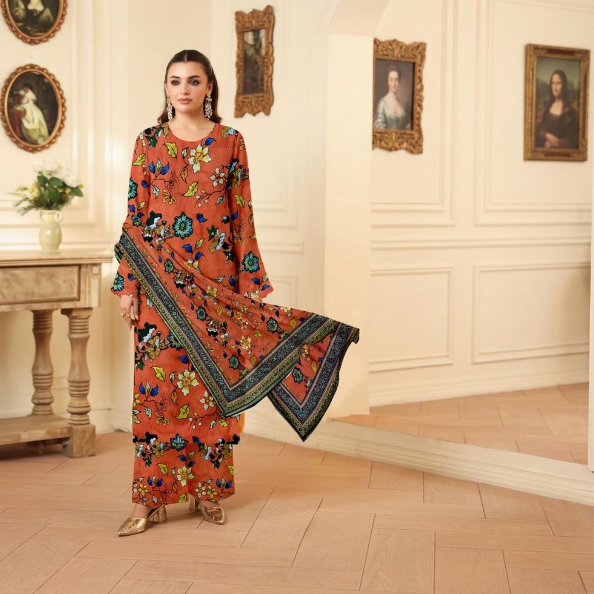 Woman in a floral dress standing in an elegant room with classical decor.
